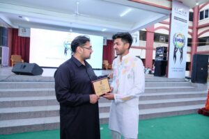 Minister Satish Sharma felicitating youth